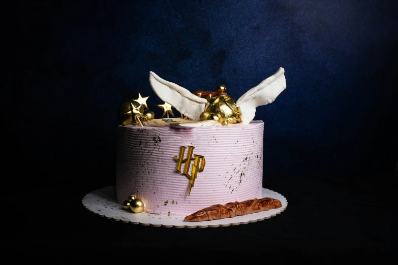 a very odd shaped cake with gold decoration