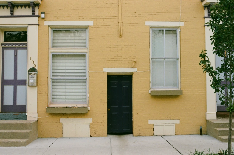 a door that is in between two windows