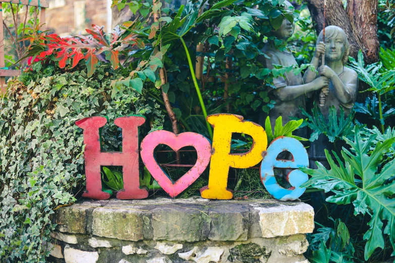 the word hope written in different colored paint