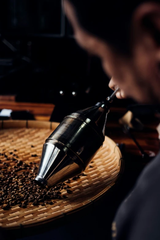 a grinder is being used for  beans