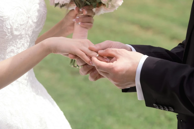 a bride holding the hand of her groom