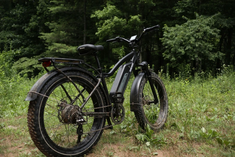 a couple of bikes parked in the grass