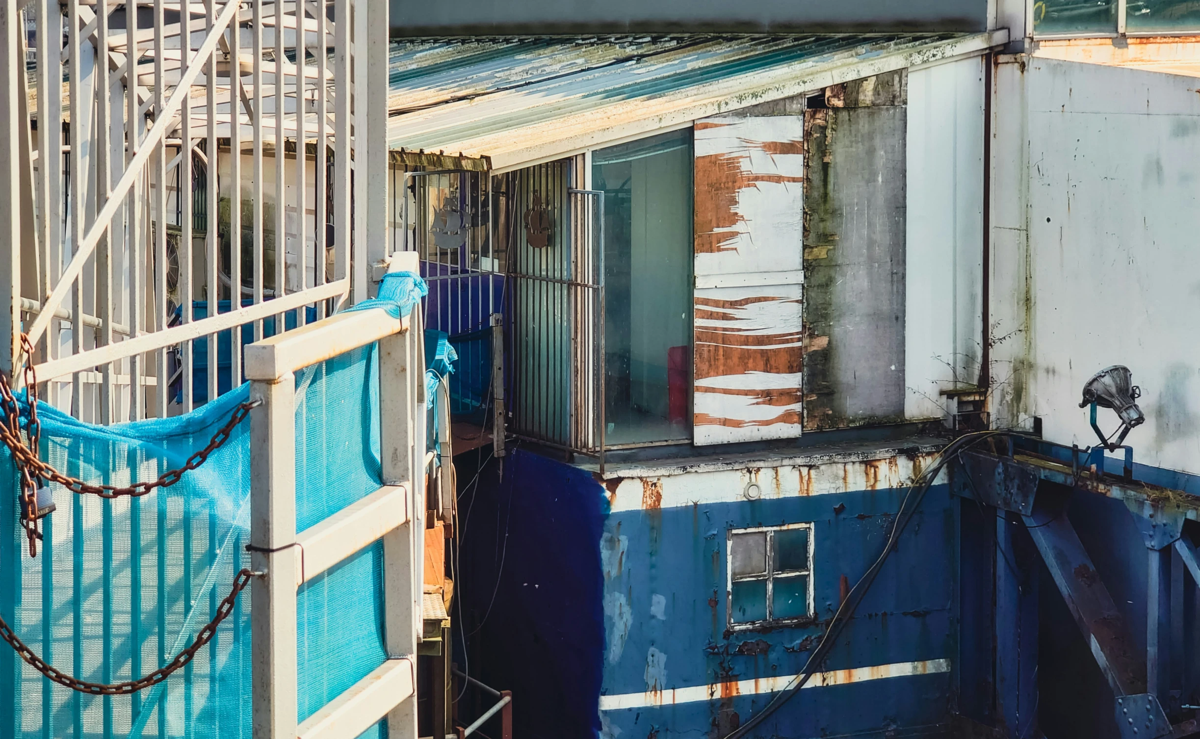 a dirty building sitting outside of a window