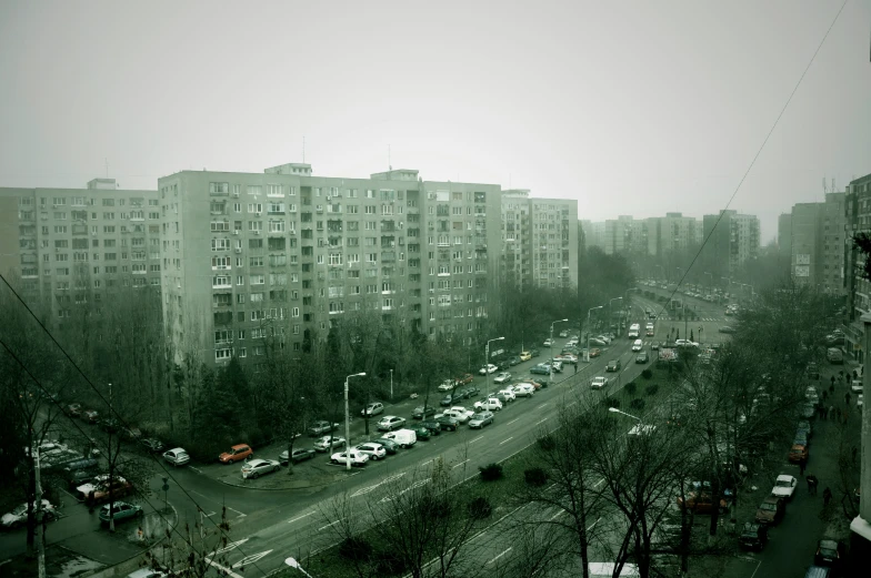 cars are parked along the busy street and streets on both sides of the road