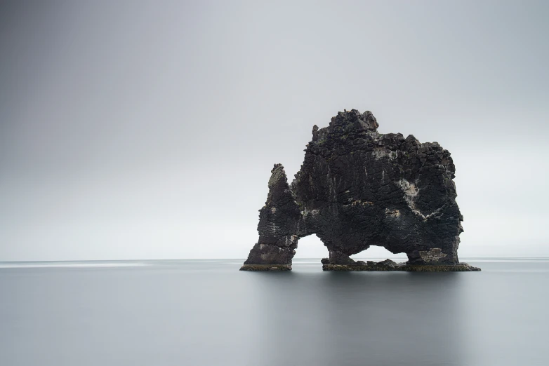 a couple of rocks sit next to each other