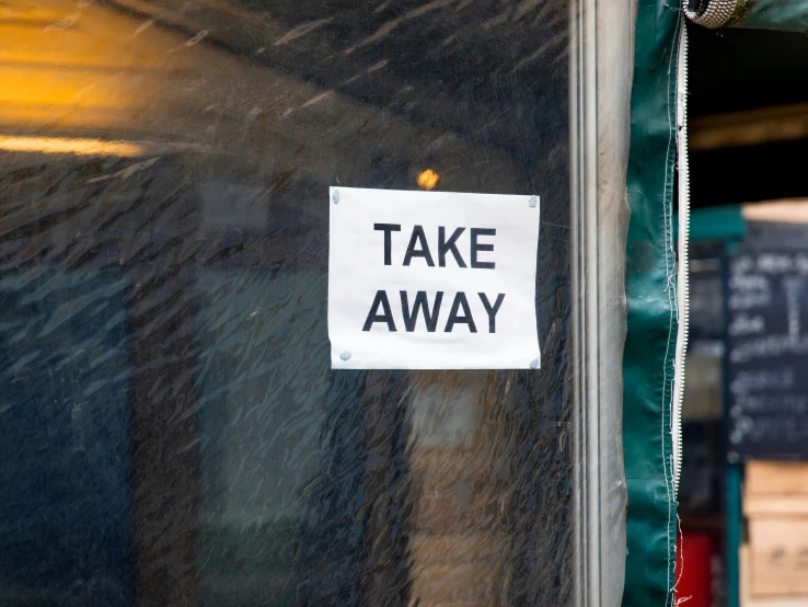 a sign hanging on the side of a building