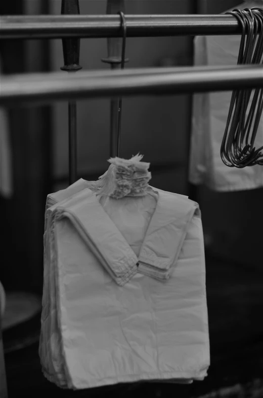 a white cloth is hanging on a hanger