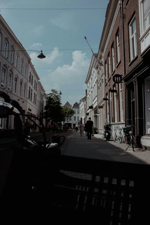 people are standing in a row by several buildings