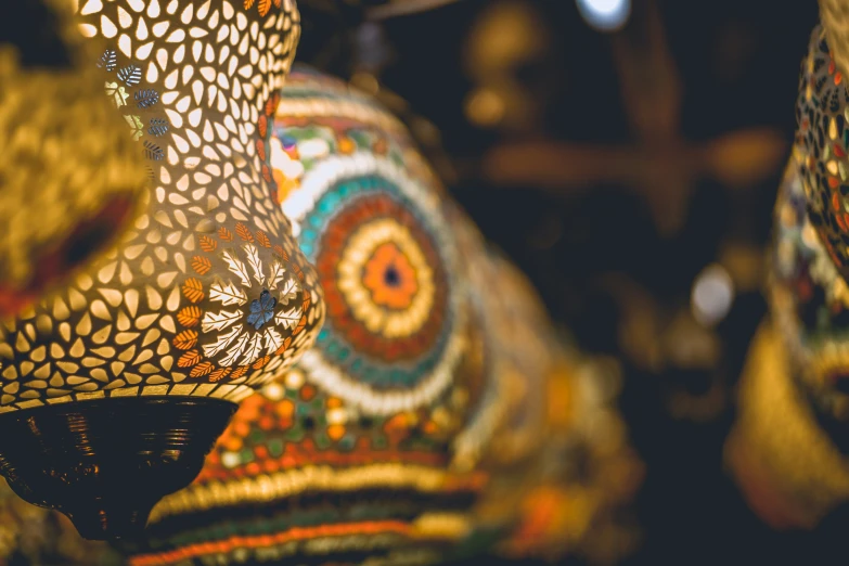 a group of three small lamps sitting on top of a counter