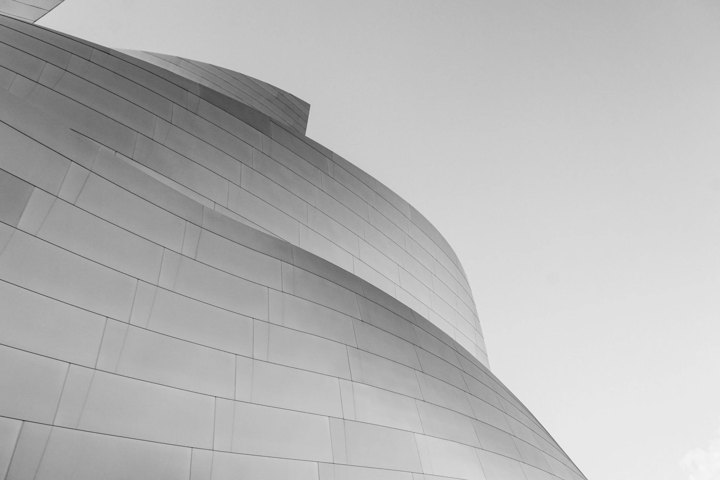 a person in a suit standing outside a building