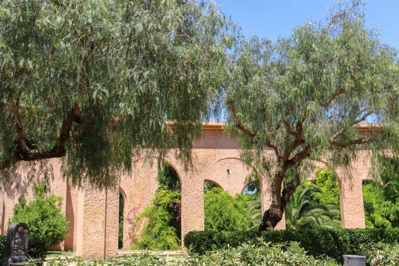 large brick structure with arches and doors at park