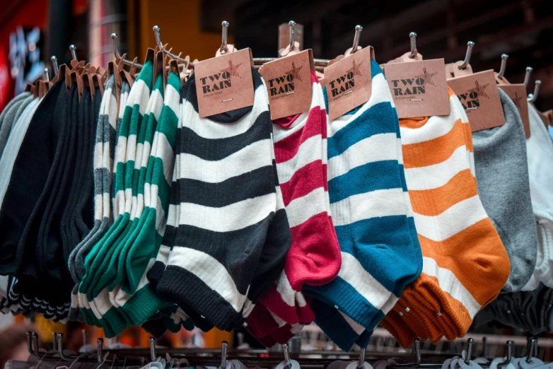 a rack full of socks is shown in a store