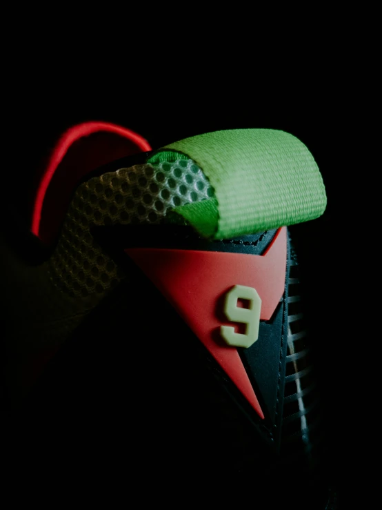 black background with light green and red shoes