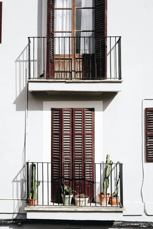 this is a view of a window and balcony in a city