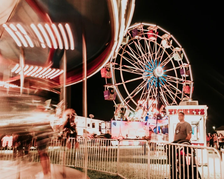 an image of people enjoying the fair at night