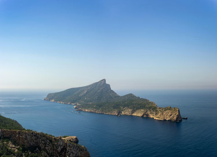 an island on the shore of a large body of water