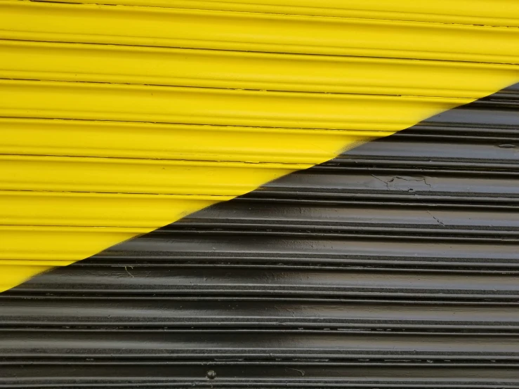 a stop sign on the side of a metal surface