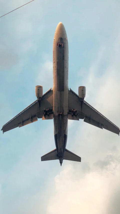 an airplane flying with it's landing gear down