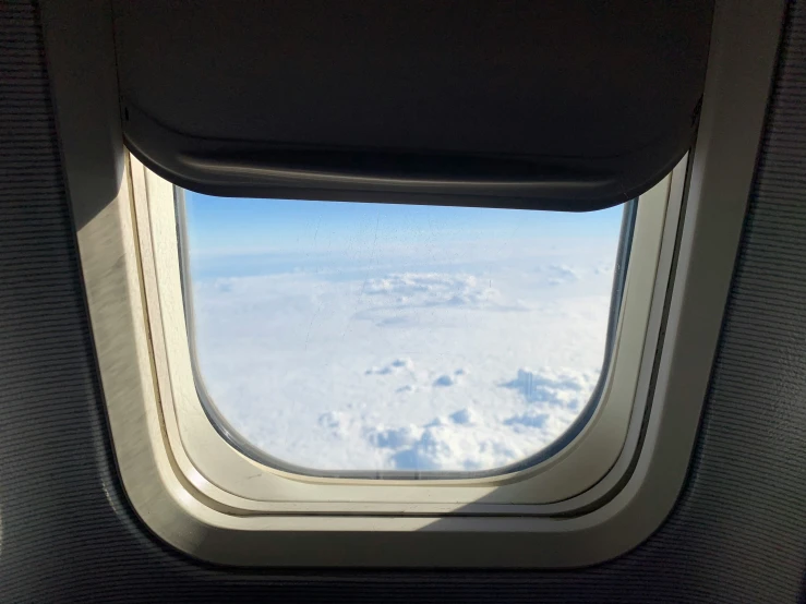 view of the clouds out the airplane window