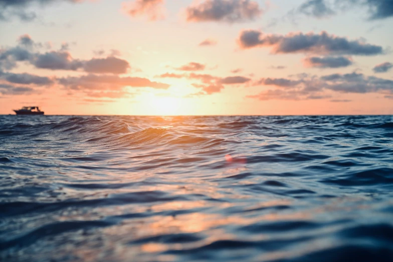 a view from the ocean during sunset or sunrise