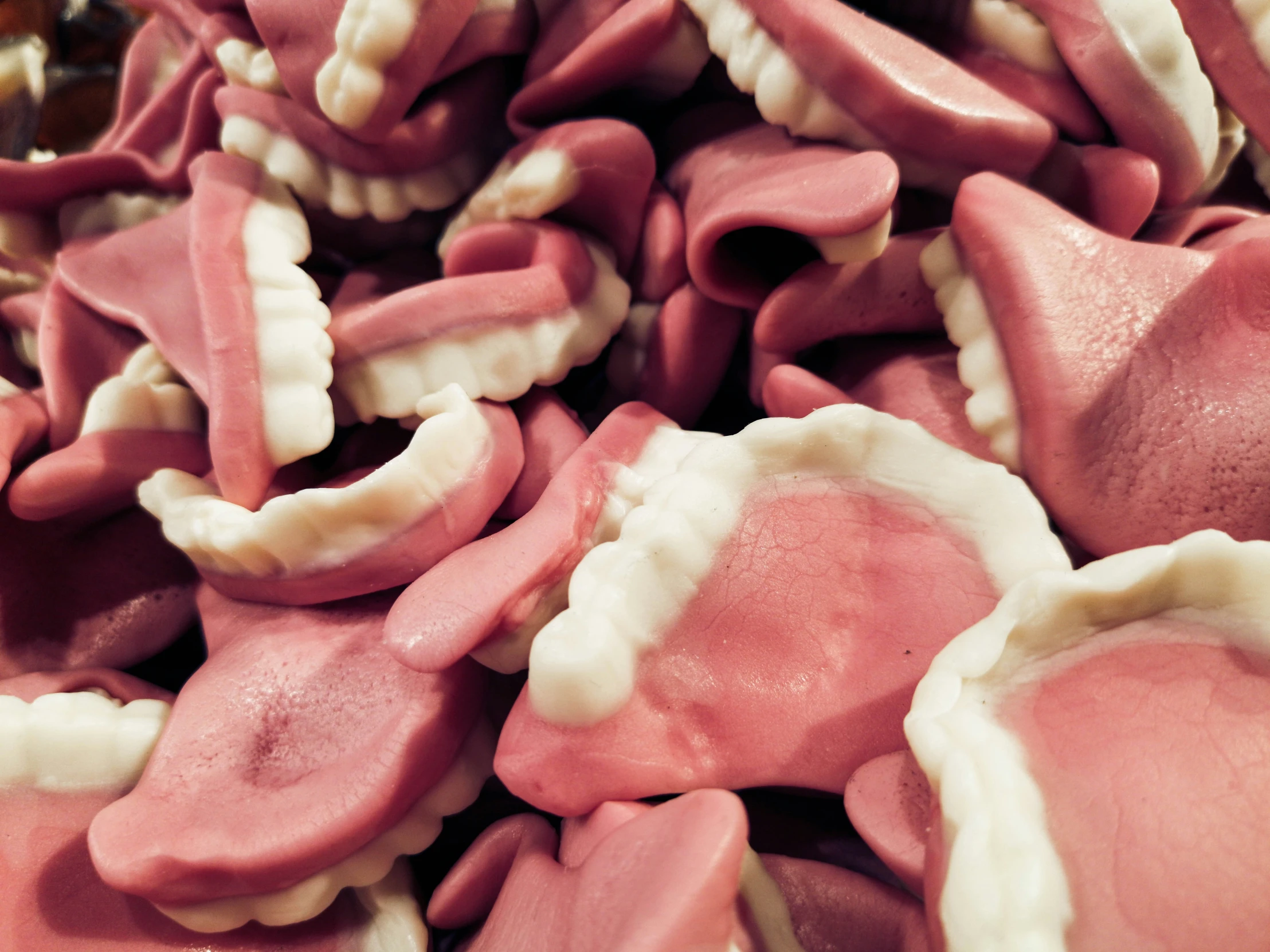 some pink and white treats with a frosting on top