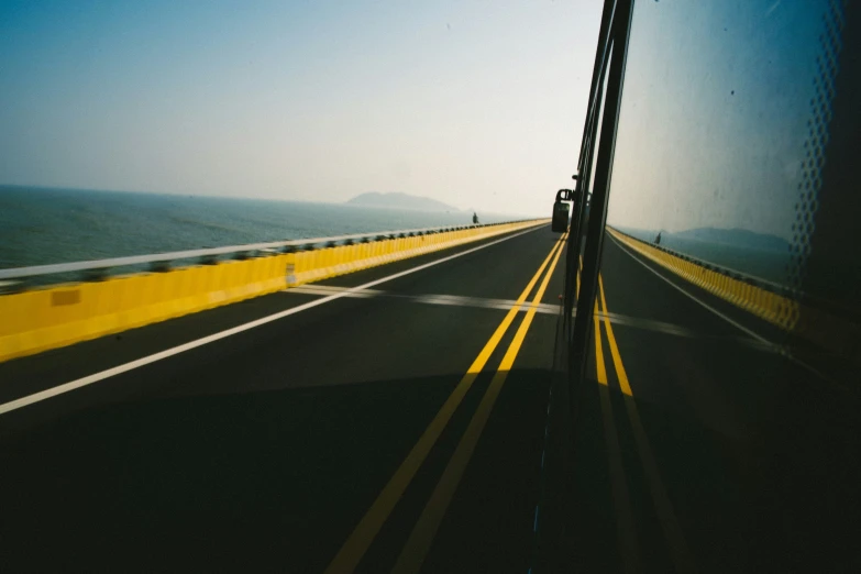 there is a reflection of a road in the windshield