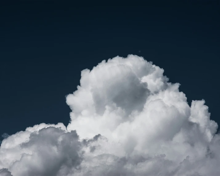 the view of an airplane flying through the cloudy sky