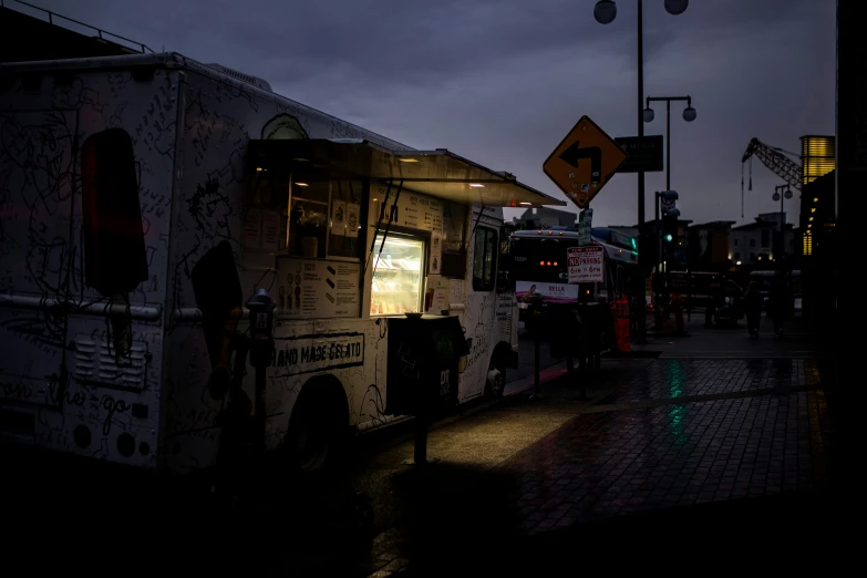 a food truck sitting on the side of a street