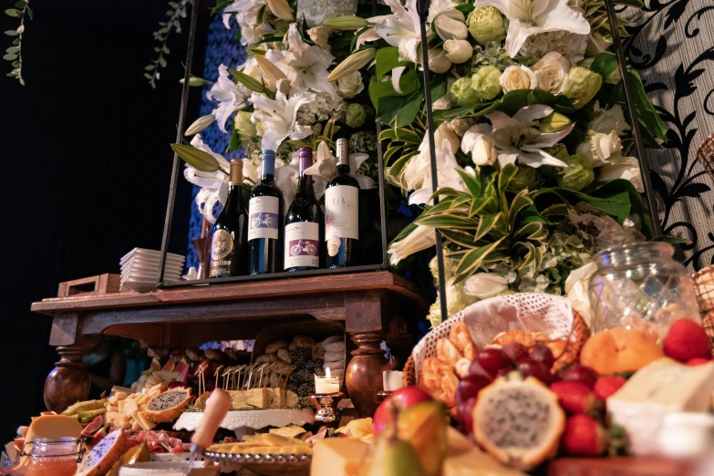 a counter with flowers and glasses on it