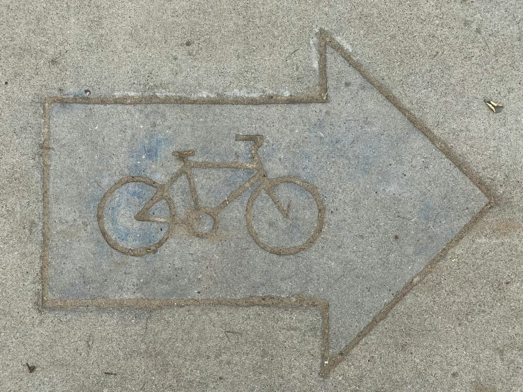 a blue arrow with a bicycle and a bike on it