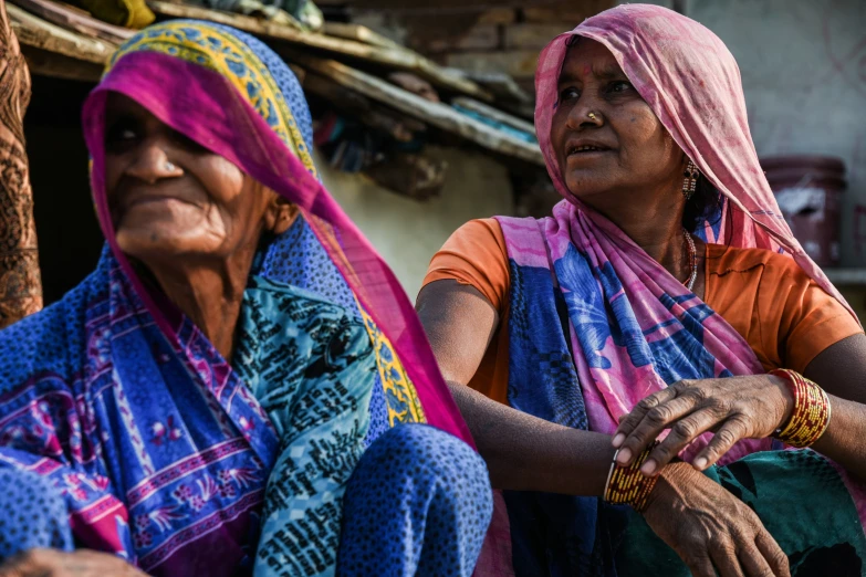 an image of two women who are looking to the side