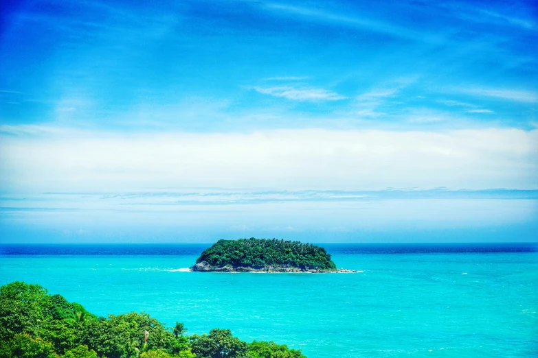 an island surrounded by water near the beach