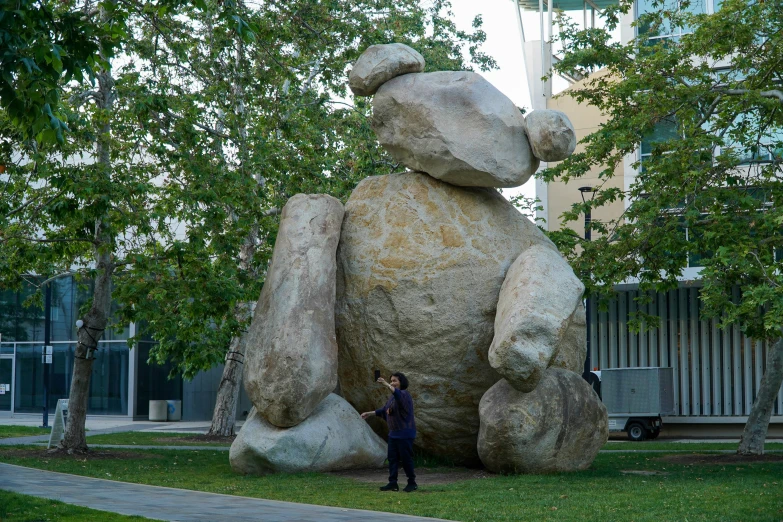 large statue of a stuffed bear in a city park