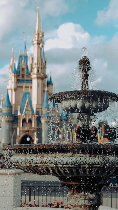 water pours out of the fountain near a building