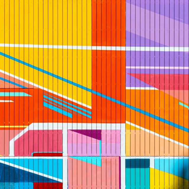 a background image of an orange, blue, red and yellow geometric wall