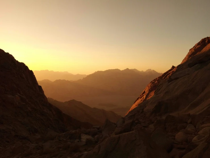 a view from a mountain of mountains and water