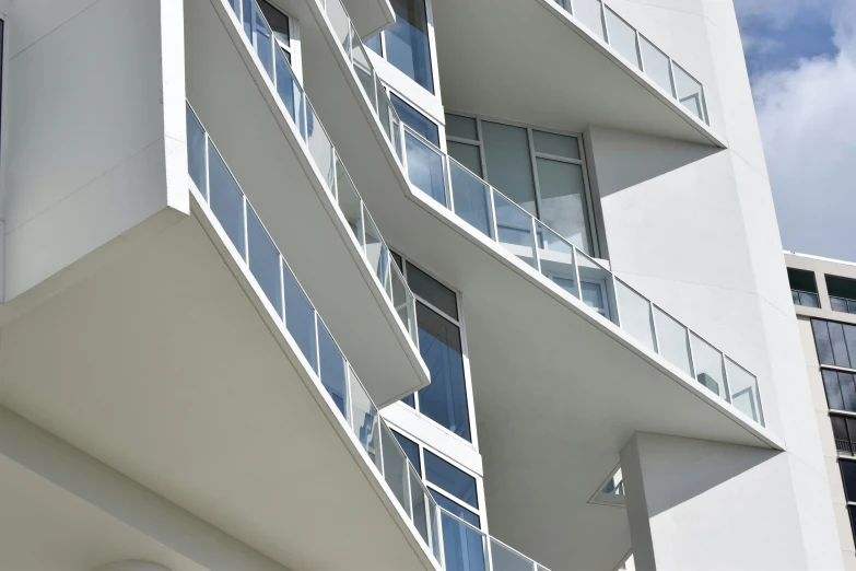 an apartment building has balconies and a round window