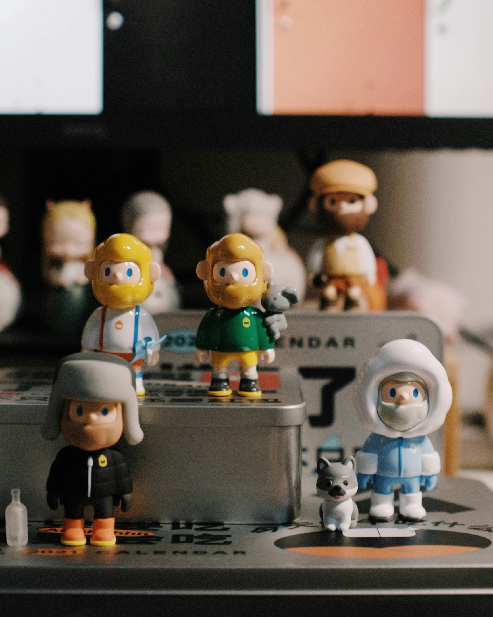 a group of action figures is sitting on the computer