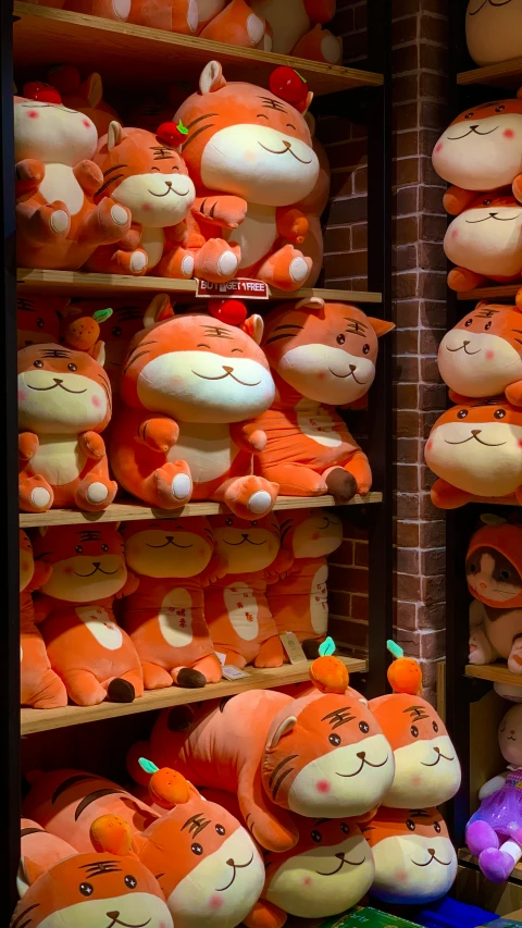 the store shelf is filled with stuffed toys