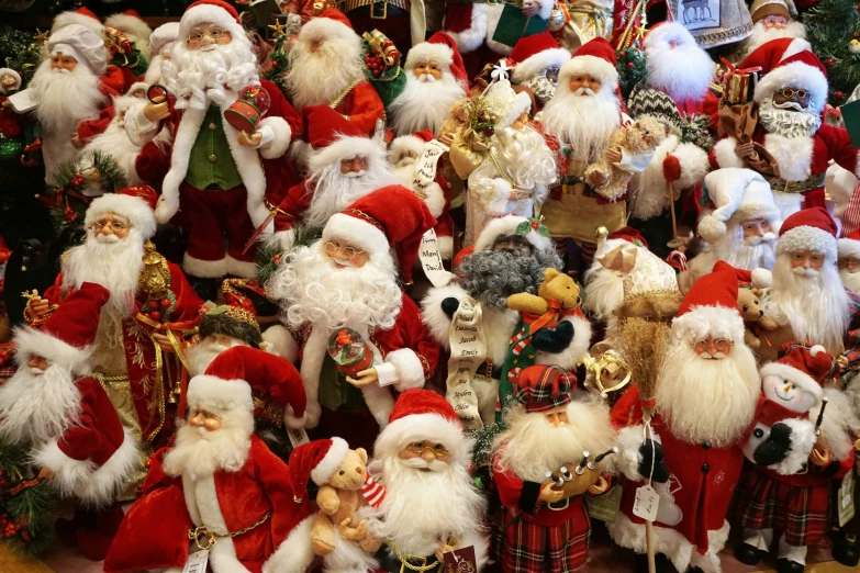 many christmas elves in red and white suit standing around the christmas tree