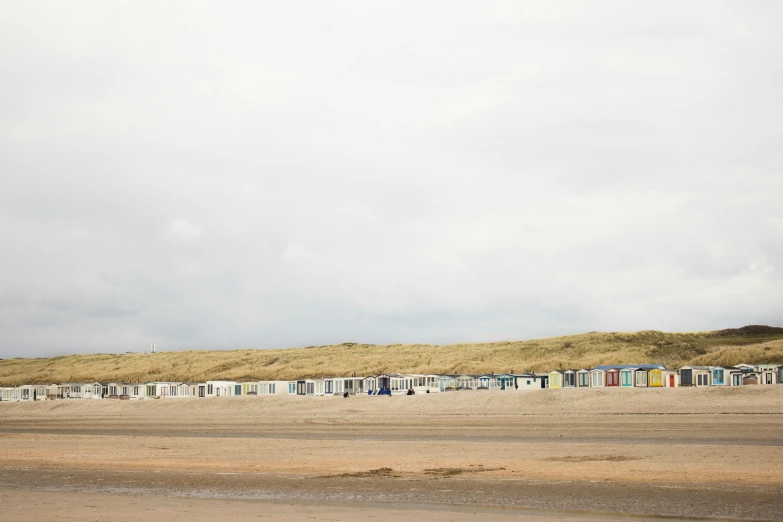 a beach with houses standing on the beach