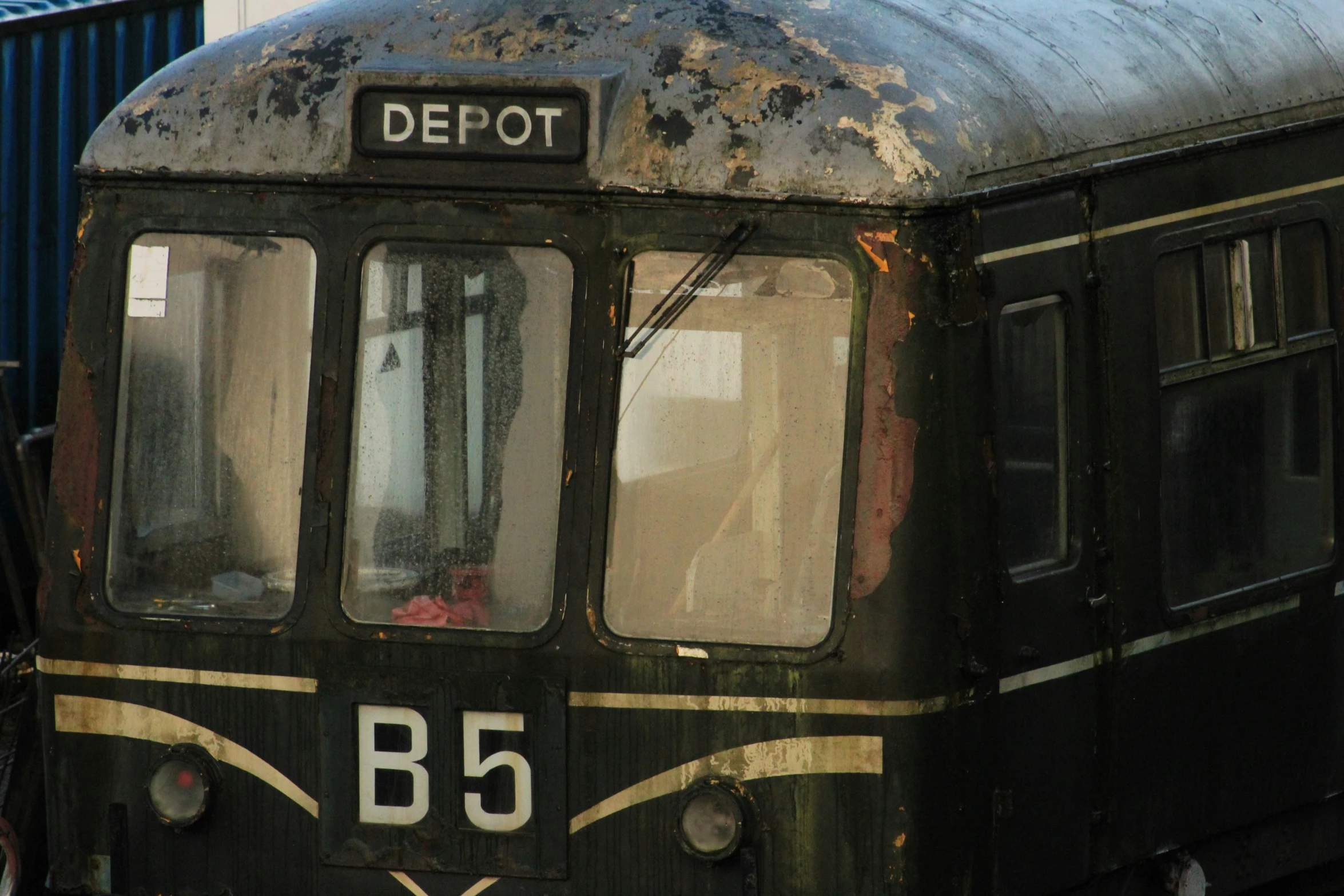 an old train car parked near another railroad car