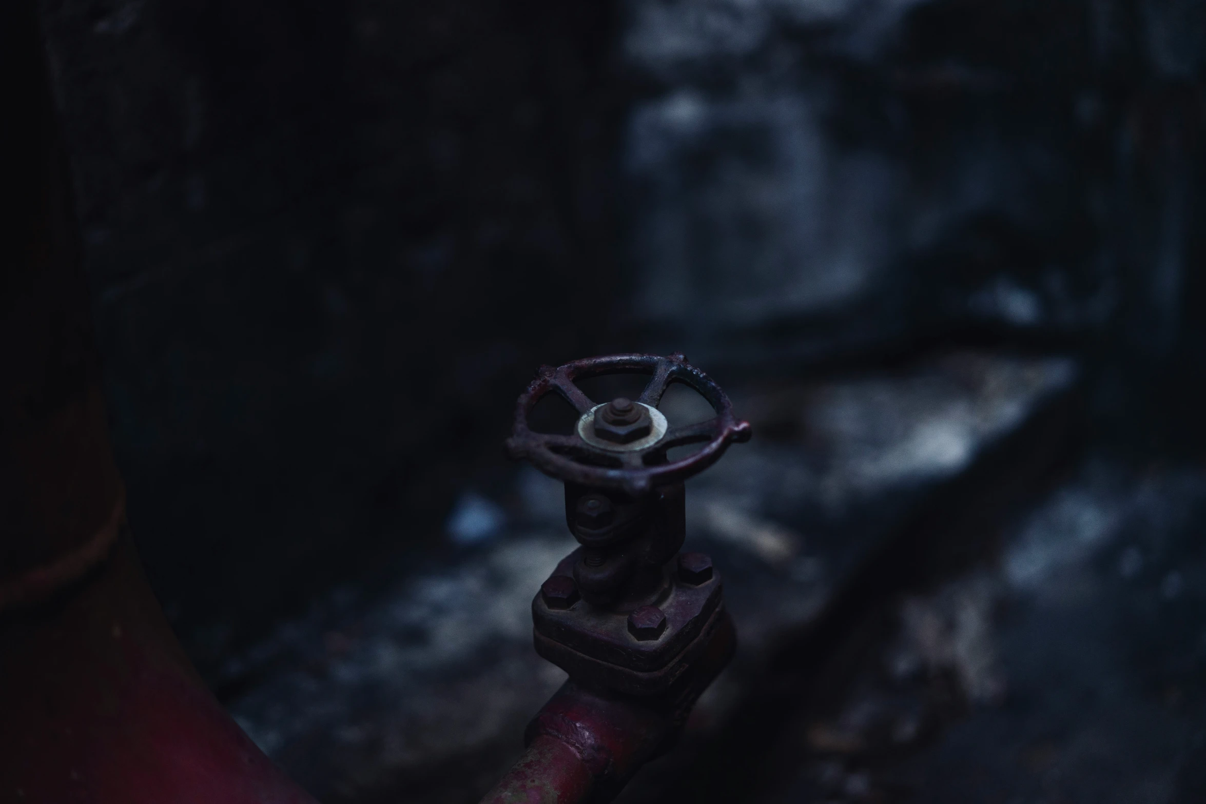 the red valve of an old water pipe