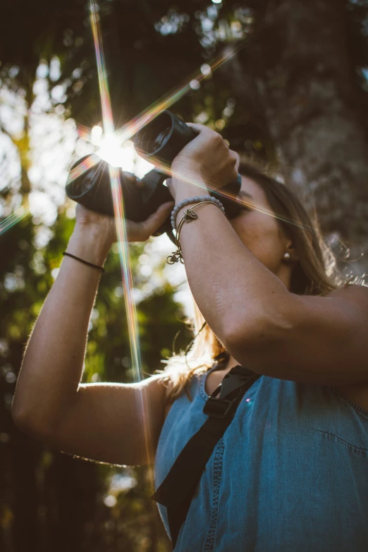 a person holding a camera taking a po with his hand