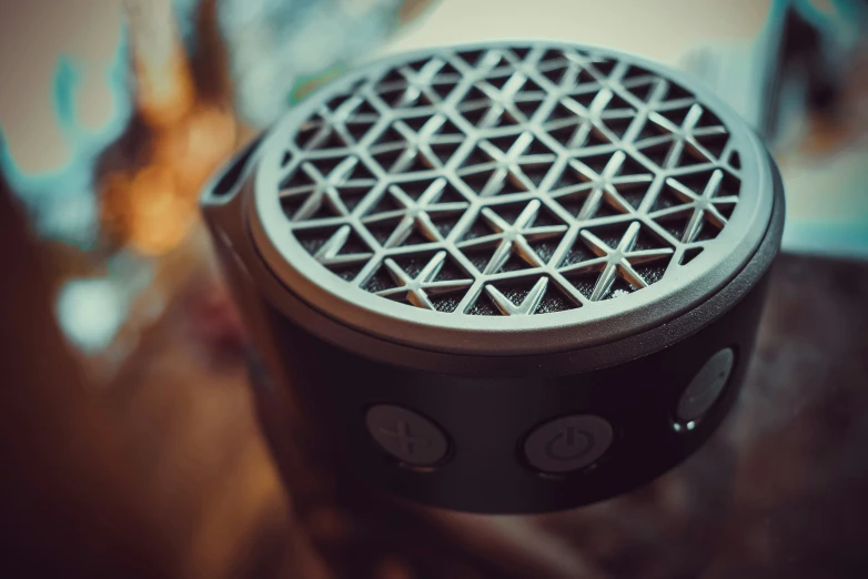 an empty speaker placed on top of a table