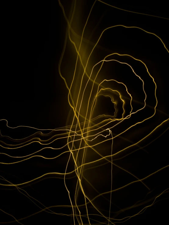 many light streaks in the air against a black background