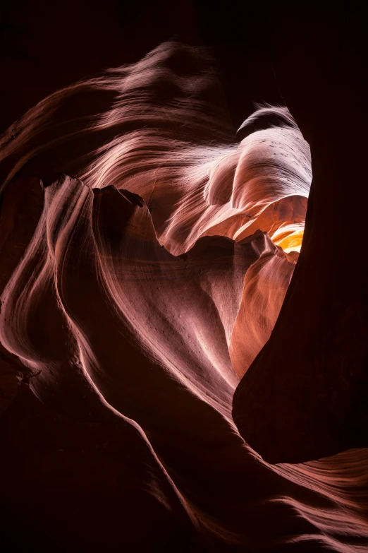 a rock formation with light shining on it