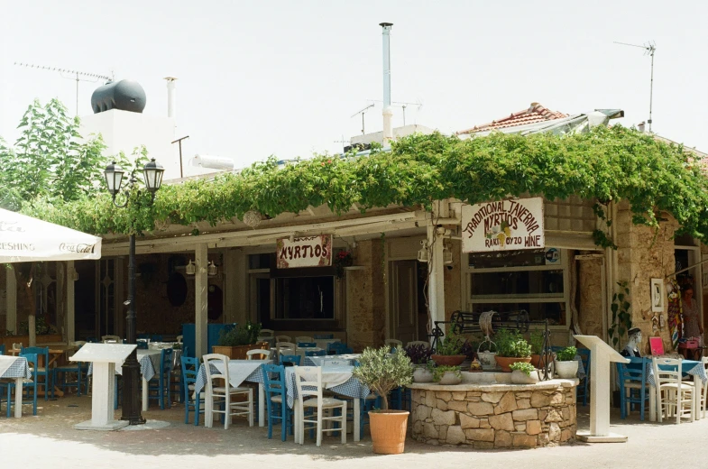 a restaurant with chairs and tables set outside