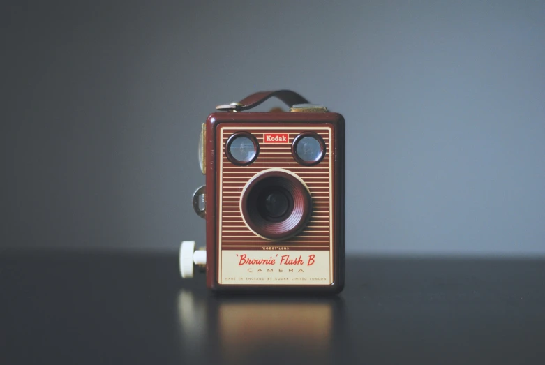 an antique camera sitting on a table