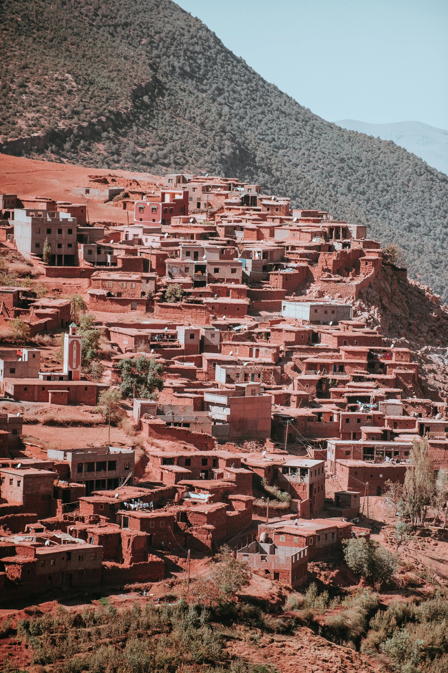 a village is perched high up in the mountainside